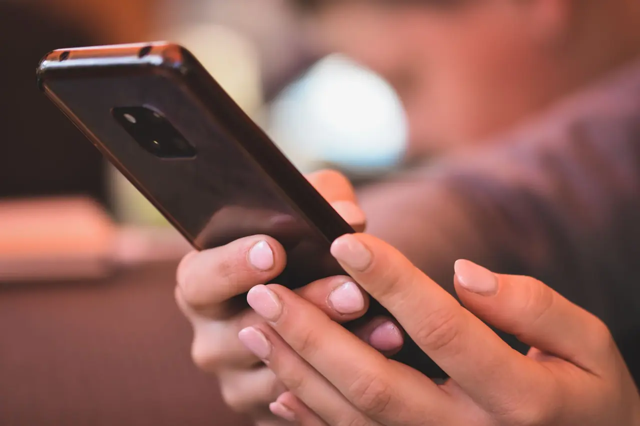 Hands holding a smartphone